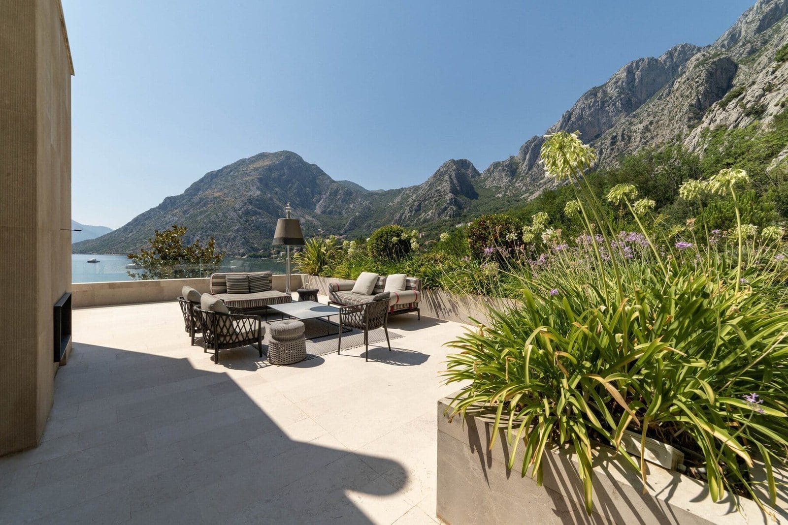 Modern outdoor terrace with mountain views and stylish seating area.