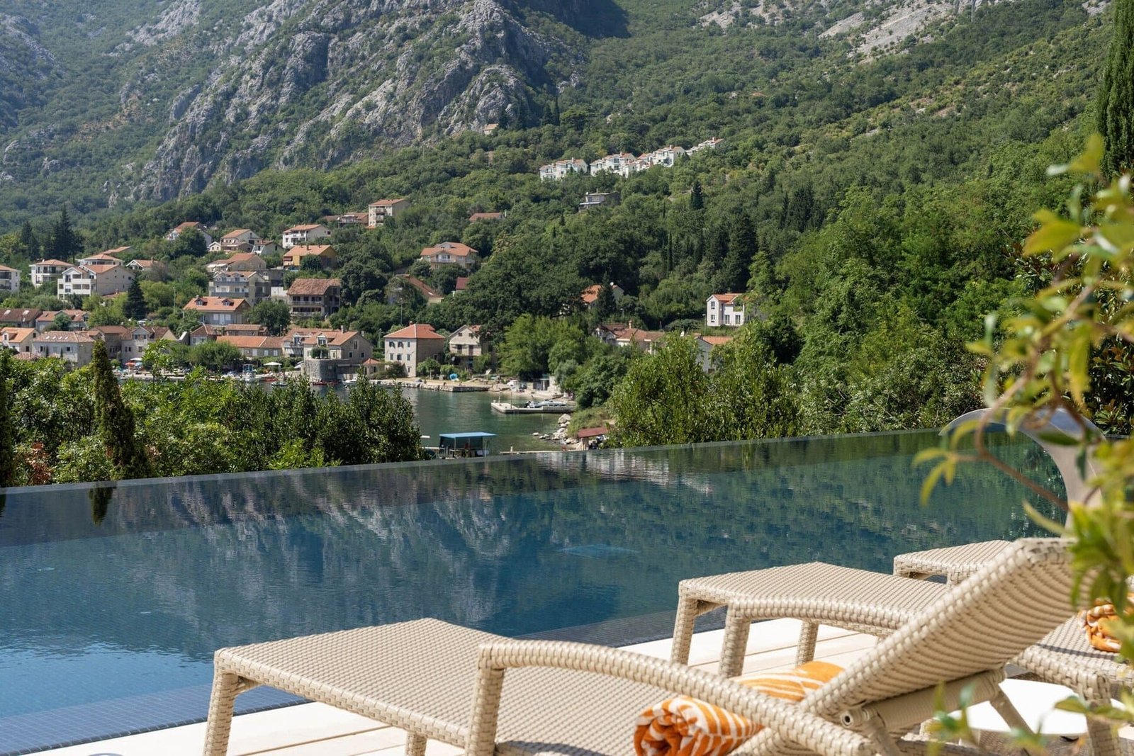 Luxury pool overlooking scenic hillside village.
