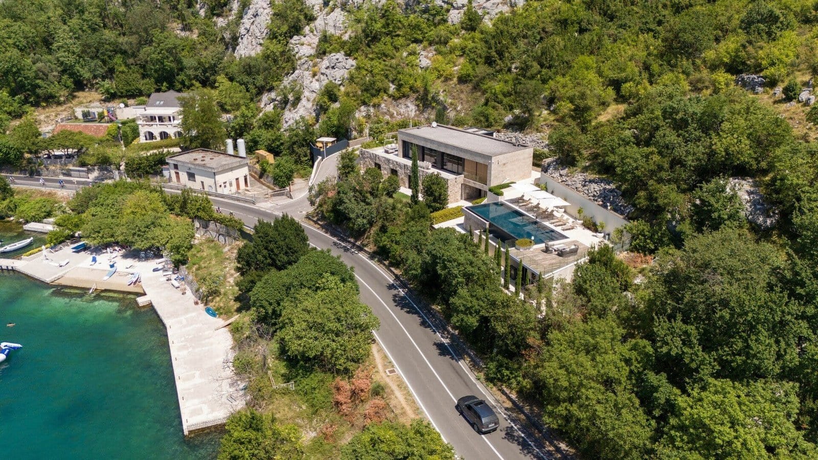 Seaside villa featuring a private pool, modern architecture, and stunning ocean views. Perfect for l.