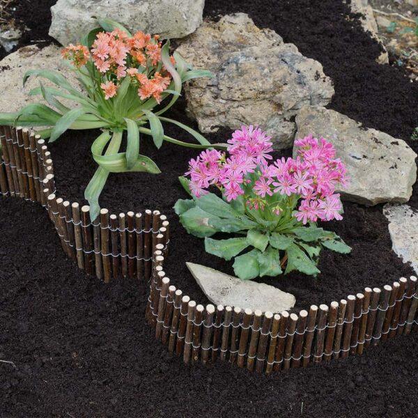 Flower bed with pink and orange primroses at Bayton Horticulture Centre.