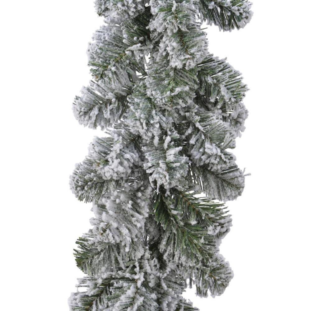 Frosted pine branch at Bayton Horticulture Centre, Christmas tree supplies, outdoor plants, gardening essentials, UK garden centre.