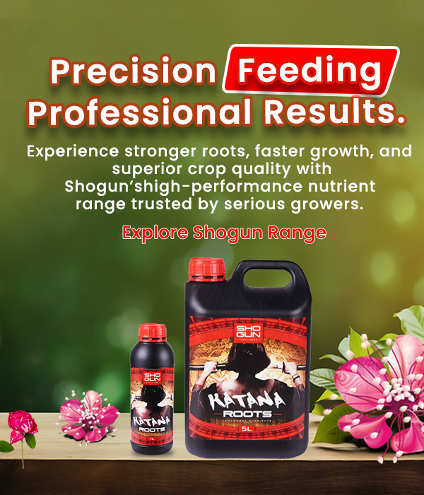 Shogun Roots fertiliser bottles with flowers on a wooden surface.