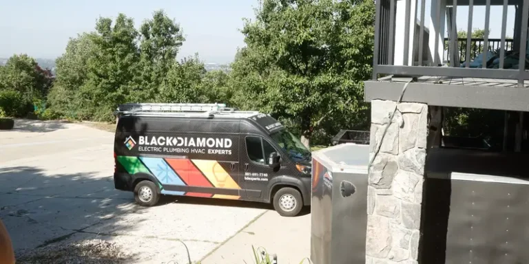 A Black Diamond Experts van with vibrant stripes is ready on a driveway, representing trusted 24/7 home comfort and repair in Utah.