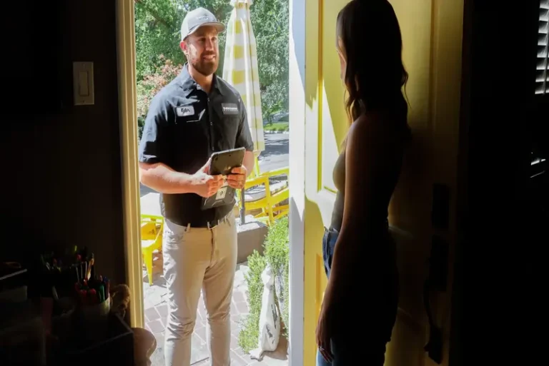 A friendly Black Diamond Experts technician arrives at the door, tablet in hand, ready to discuss a quality home electrical upgrade.