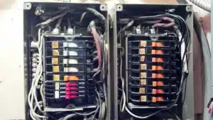 Two open electrical breaker panels, neatly wired with multiple breakers—expert service from Utah’s trusted 24/7 home comfort team.