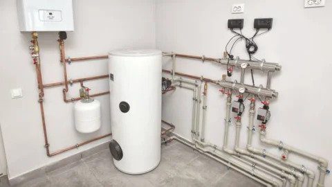 A well-installed water heater setup with tank, controls, and plumbing—showcasing Black Diamond Experts’ trusted 24/7 home services.