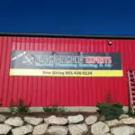 A red Black Diamond Experts building with service sign, phone number, and welcoming entry—trusted Utah experts for 24/7 home repairs.