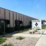 A welcoming beige building with a “Silverman” sign out front, large windows, and a walkway leading to the trusted service entrance.