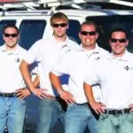 Four skilled Black Diamond Experts in uniform stand proudly before a service van, ready 24/7 for Utah’s home comfort and repair needs.