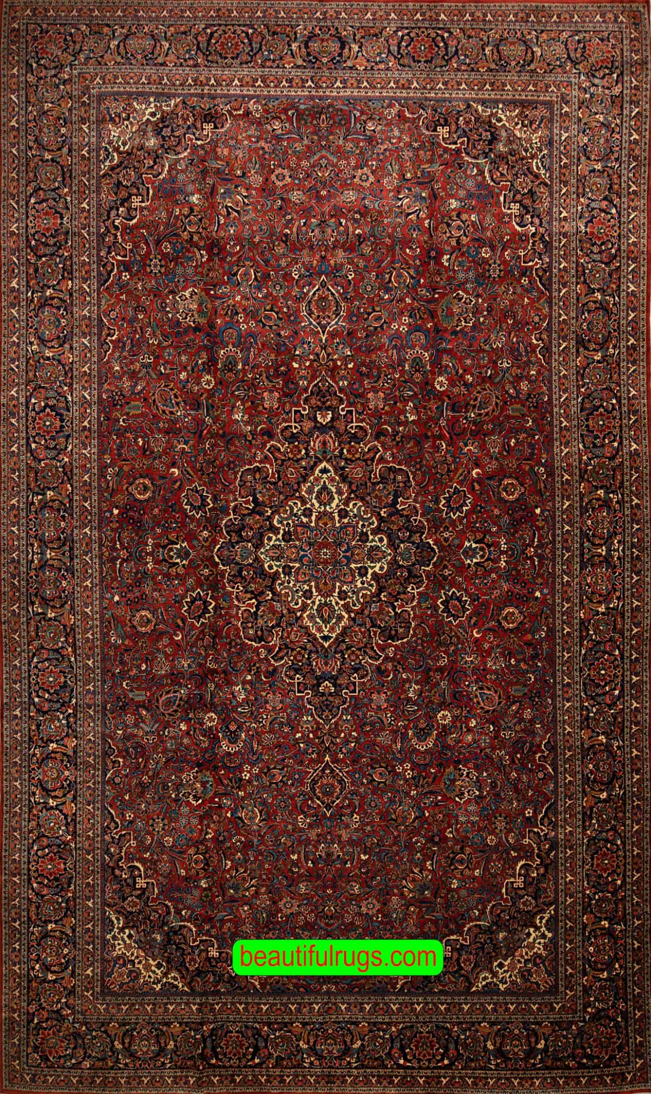 Oversized rug, hand woven antique Persian Kashan rug in reddish terracotta color. Size 10.3x17.