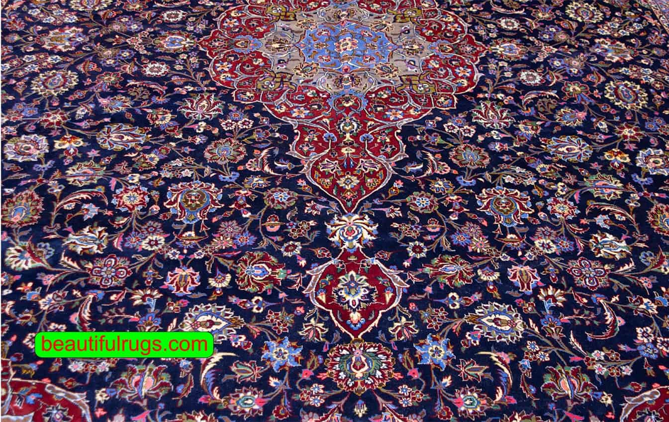 Persian Kashan wool rug with navy blue and red colors. Size 11.4x16.3.
