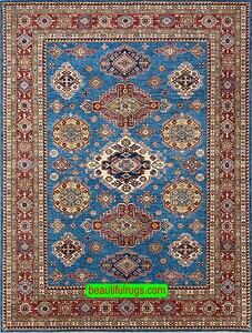 Geometric Kazak style rug in blue color made in Pakistan. Size 8.2x10.6.