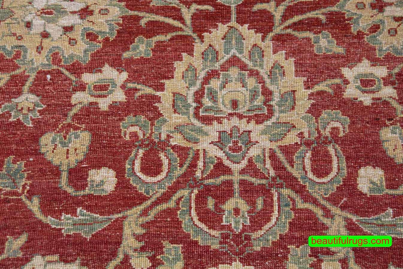 Handmade floral Pakistani wool area rug in red color. Size 8x10.4