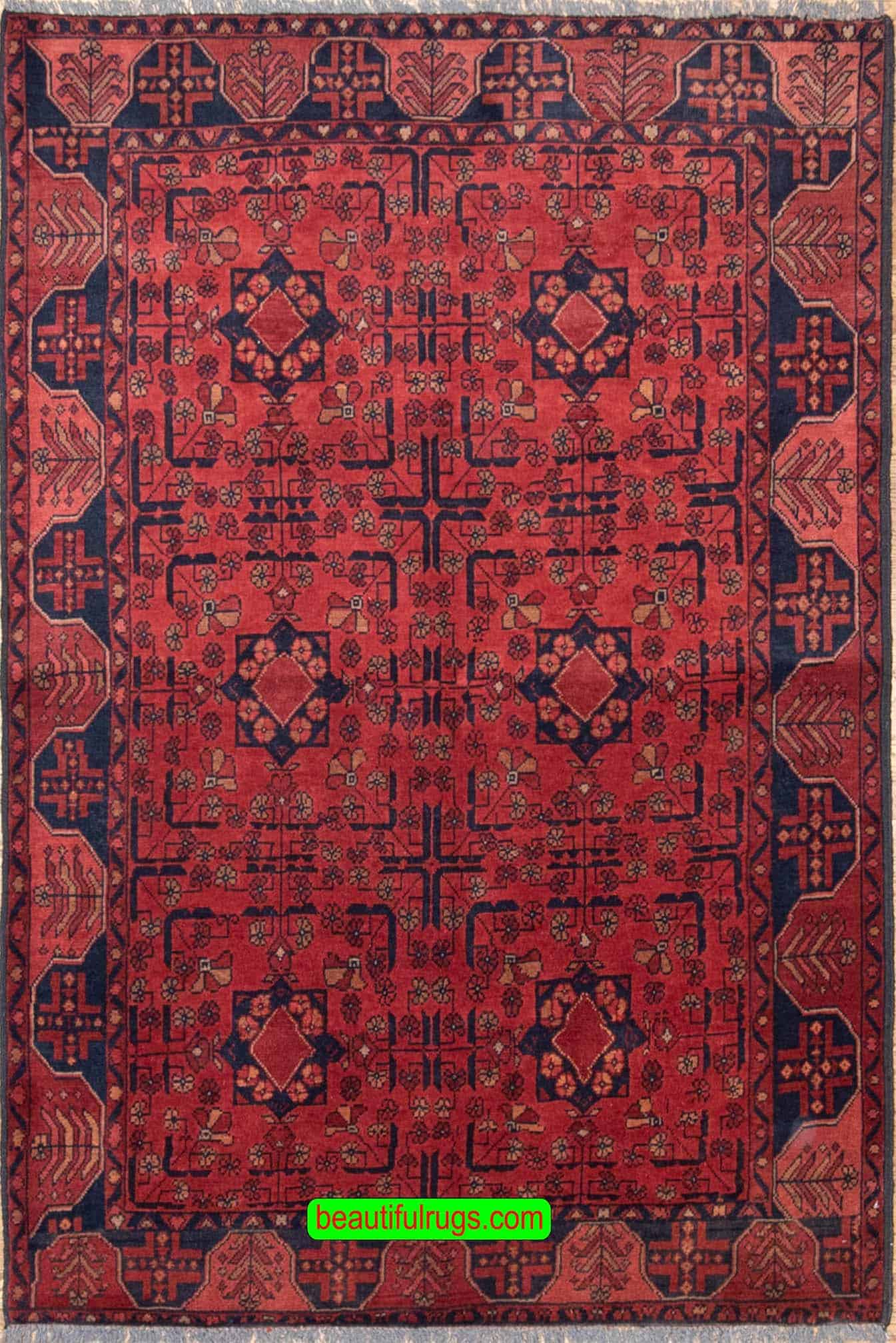 Handmade Afghan Kunduz rug in red and black color made of wool. Size is 4.10x6.7.