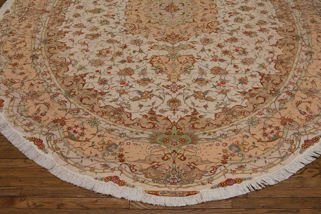 3227- A gorgeous large size handmade Persian Tabriz oval rug made of wool and silk masterfully color coordinated. Size 8.5x11.10.  