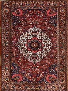 Oriental carpet, antique Persian Bakhtiari rug in red color and white medallion.