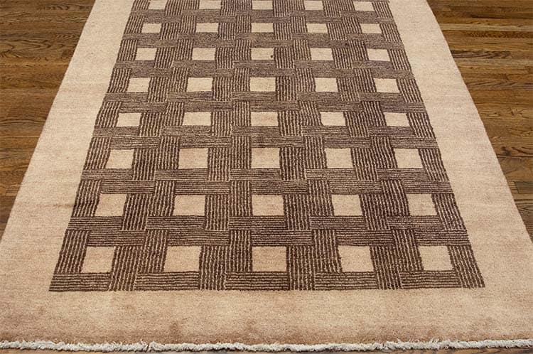Brown area rugs made of 100% wool with color combination of brown and beige.