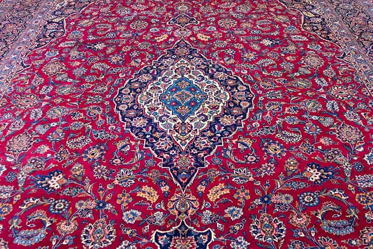 11x15 rug, semi antique Persian Kashan rug in red and navy blue made from fine wool.