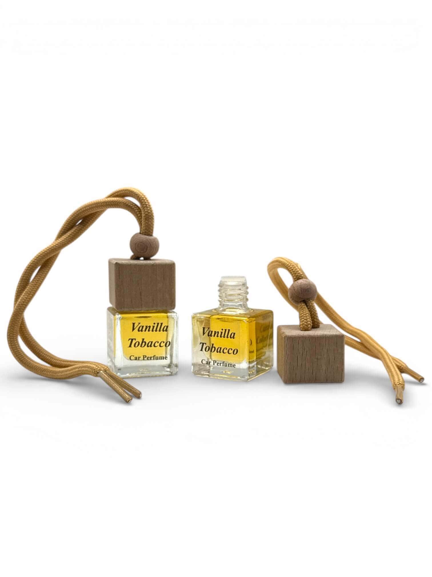 Vanilla Tobacco car diffuser with essential oil bottles and wooden accents.