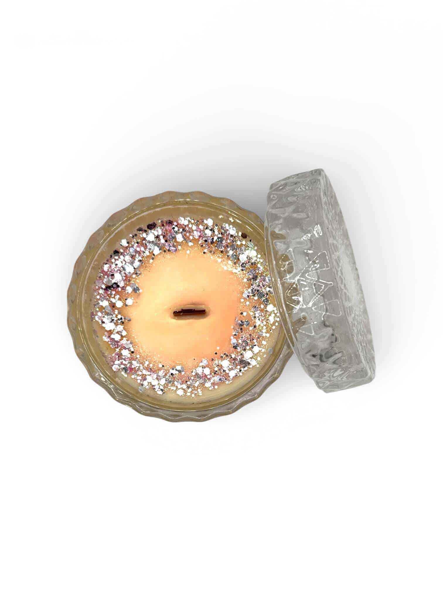 Elegant Baccarat Rouge scented soy candle with glitter accents.