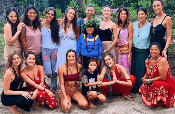 Healing retreats with diverse women in lush outdoor setting for wellness and relaxation.