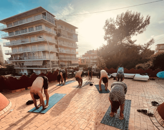 Yoga practitioners practicing outdoor yoga at La Mezquita retreat.