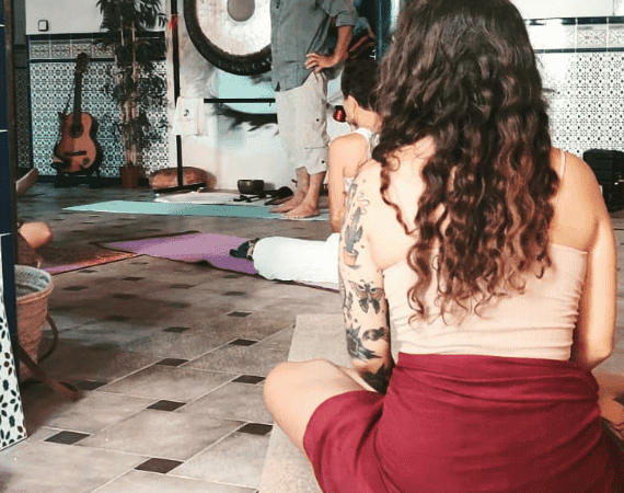 Relaxing meditation session in a serene retreat setting near La Mezquita.