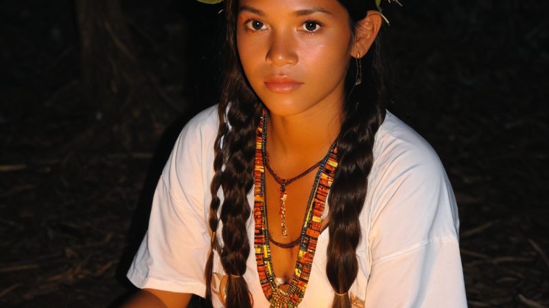 Ayahuasca ritual with a young woman in a natural setting, emphasizing spiritual retreats and persona.
