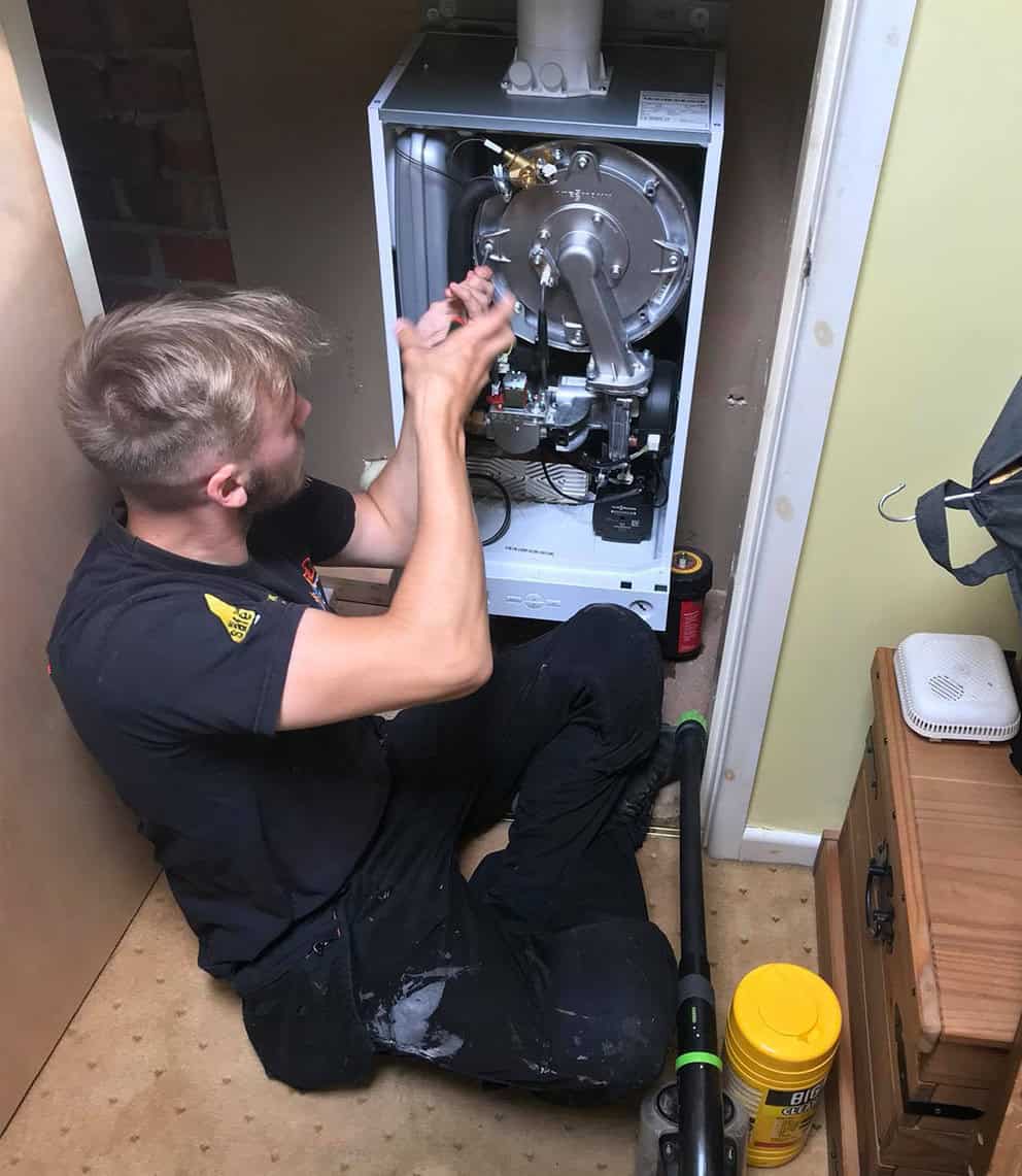 Technician installing a boiler in a residential property in Blackpool.