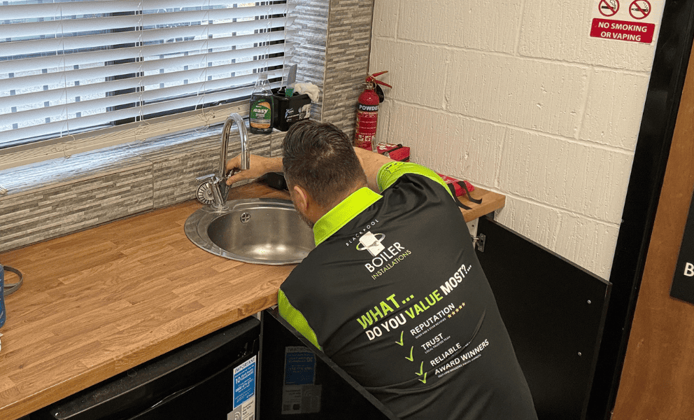 plumber in action blackpool boiler installations tap repair