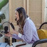 woman making a radio jingle