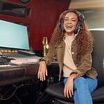 woman laughing at the recording studio