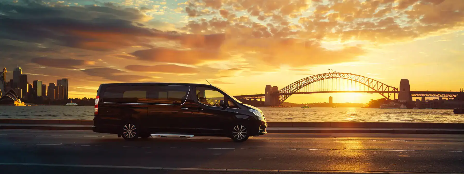 a sleek, chauffeur-driven van glides effortlessly along the bustling streets of sydney, with the iconic sydney harbour bridge majestically looming in the background under the warm glow of sunset, symbolizing the elegance and efficiency of corporate airport transfers.