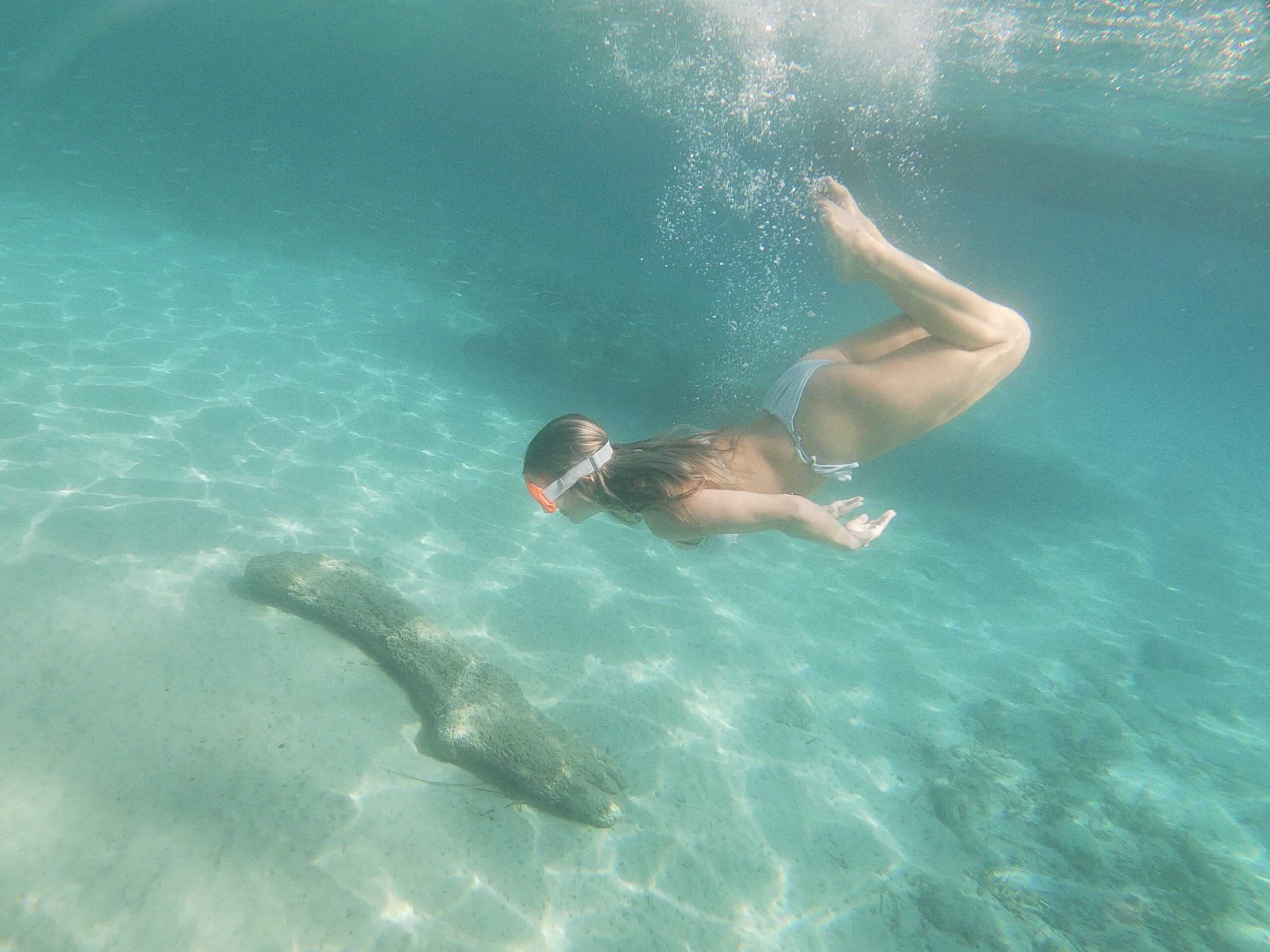 Girl Diving in Crystal Clear Adriatic SeaGirl diving on our private boat hire in Dubrovnik
