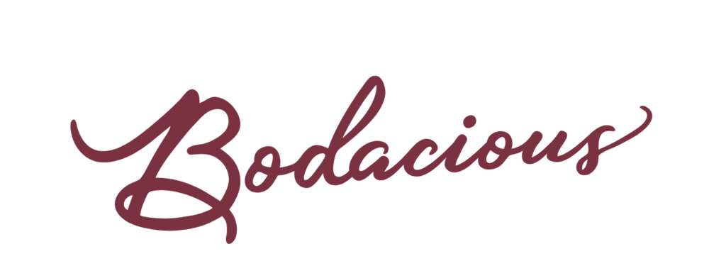 Bodacious Shops logo in cursive style on a mauve background.