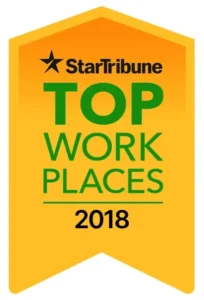 Star Tribune Top Workplaces 2018 award badge in yellow, featuring green and black text with a star logo at the top.