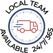 Icon of a delivery truck in motion, surrounded by the text "Local Team Available 24/7/365" in a circular design. For prompt service, Contact Us anytime.