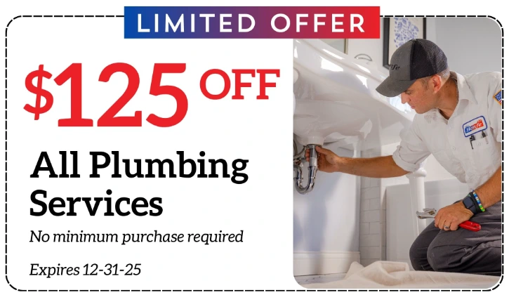 A plumber works under a sink; text reads "$125 off all plumbing services, no minimum purchase required, expires 12-31-25, limited offer.