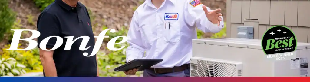 A Bonfe technician speaks with a customer outdoors near an air conditioning unit, proudly wearing a "Minnesota's Best Silver Winner 2023" badge, as featured in the March 2026 edition of Bonfe Insider.