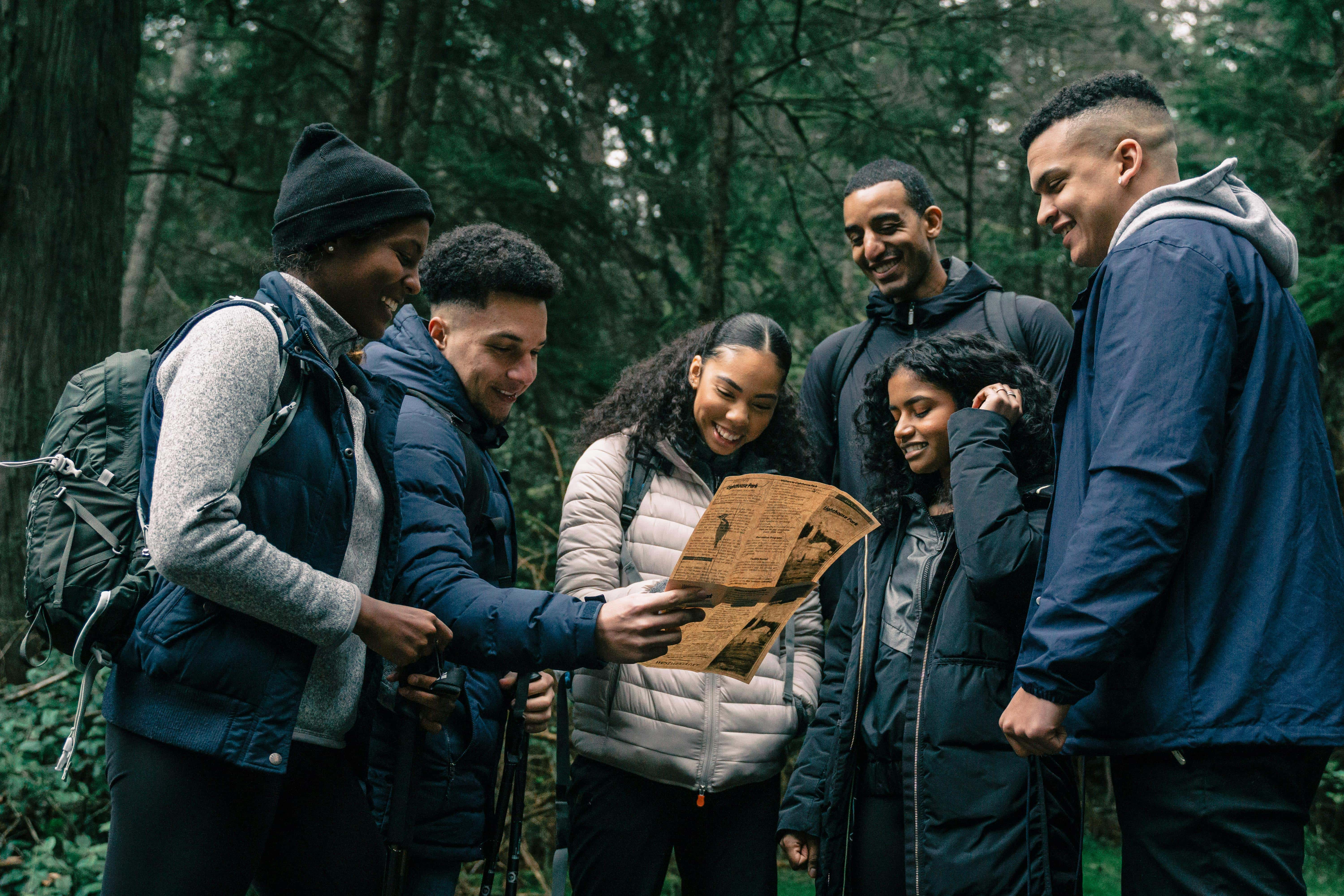 Family staying active together outdoors with creative fitness activities like hiking and obstacle courses.