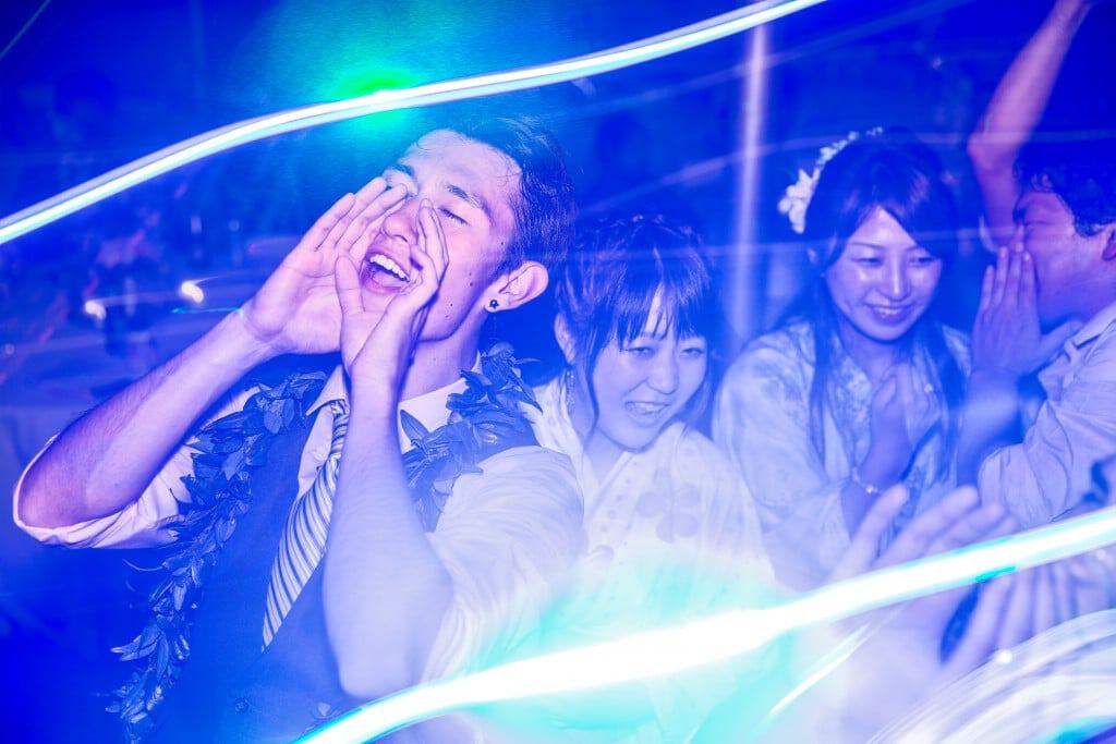 A La Crosse WI wedding photographer capturing a group of people dancing at a party.