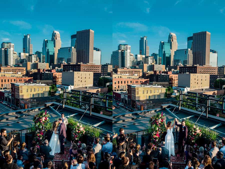 A wedding ceremony on a rooftop with the city skyline in the background.