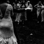 Courtney and James dance in front of a crowd at their love-filled wedding.