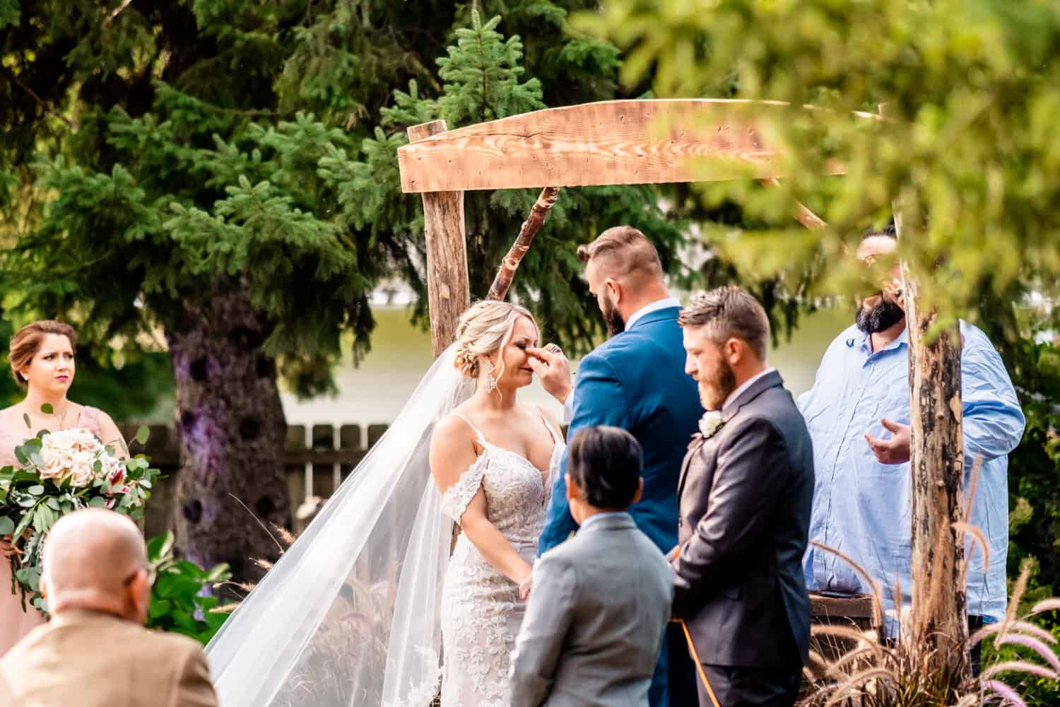 A couple shares emotional vows during their backyard wedding ceremony in La Crosse.