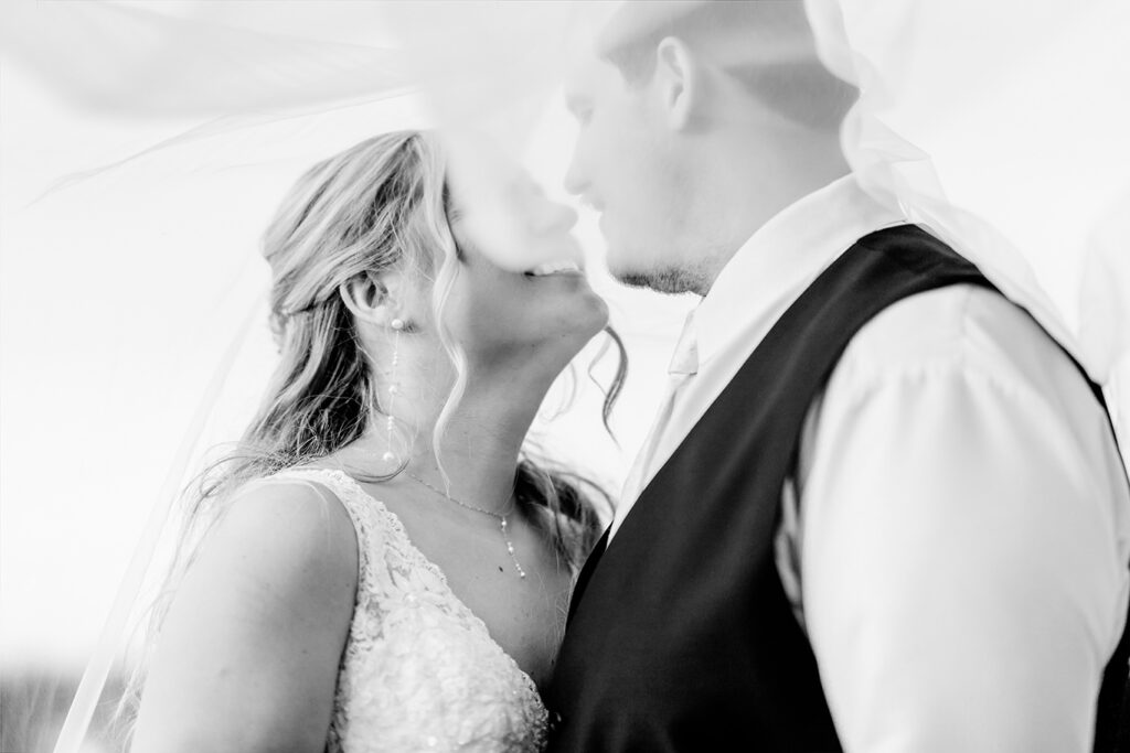 black-and-white-intimate-bride-groom-kiss-wedding-portrait.jpg