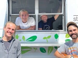 StreetGreens truck with smiling volunteers