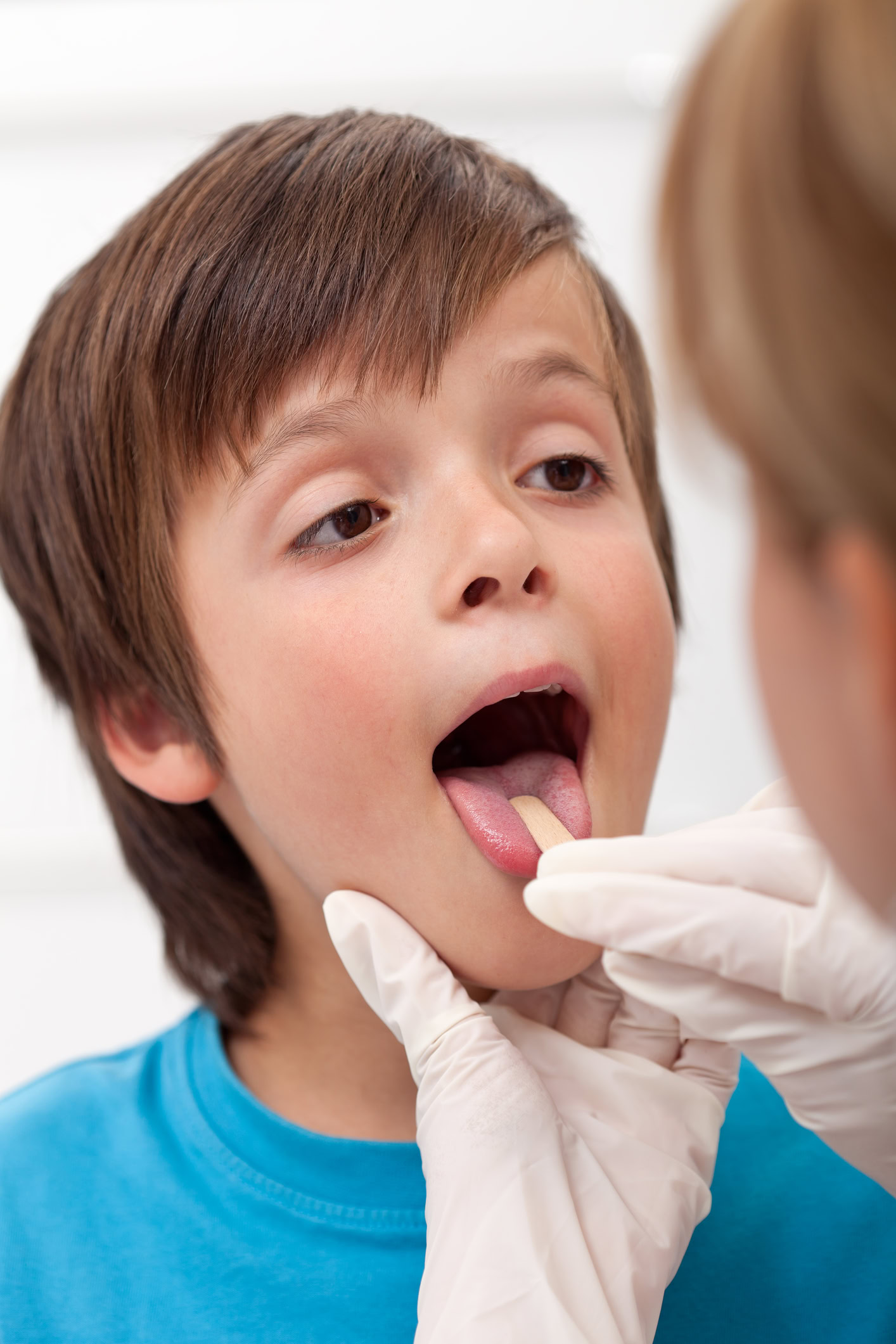 Dentist working with a patient during oral therapy session
