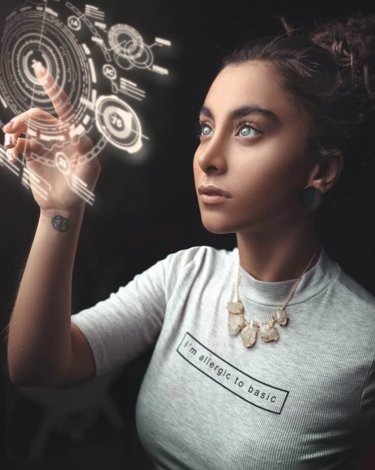 A Woman In A Futuristic Career Touching And Moving Digital Images In The Air.