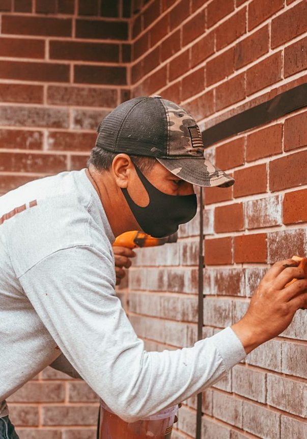 brick restoration mason crew working