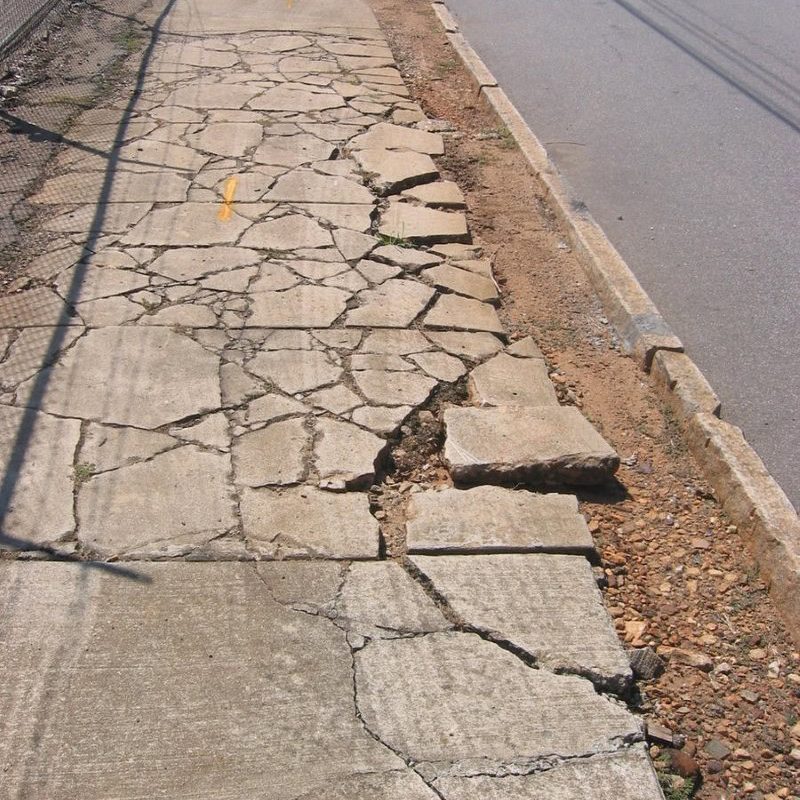 Broken and Cracked Sidewalk Broken and Cracked Sidewalk